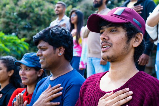 Side View Shot Of Spectators Or Audience Singing National Anthem At Stadium Before Match - Concept Of Nationalism, Independence And Sports Tournament