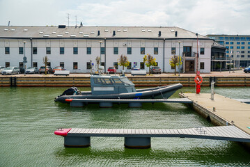 Police and border guard boat moored in dock.