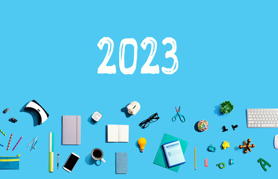 2023 new year concept with collection of electronic gadgets and office supplies