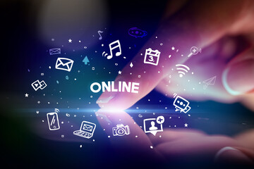 Finger touching tablet with social media icons concept