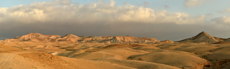 Panoramic landscape of Judaean Desert with sandy hills at sunrise, Israel, Palestine.