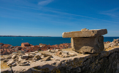 Fototapeta na wymiar A stone wall overlooking the old medieval centre of Piran on the coast of Slovenia 