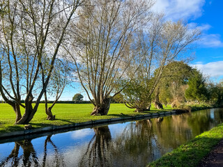 Obraz premium View of the canal and fields behind. Selective focus 