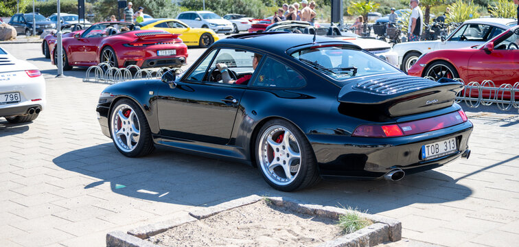 Falkenberg, Sweden - July 30 2022: Black 1993 Porsche 993 Turbo at Skrea Strand.