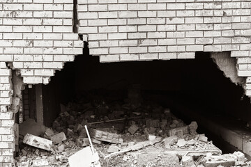 Building Exterior Wall Cracked Damaged Closeup abstract background sepia black and white photograph.