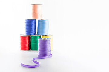 skeins with multi-colored ribbons for tailoring on a white background, save space