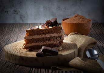 Delicious chocolate cake with fluffy cocoa sponge and marble effect icing. Dark food