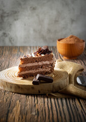 Delicious chocolate cake with fluffy cocoa sponge and marble effect icing. Dark food