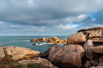 France, Ploumenach, 2022-01-13. Rock formation along the pink granite coast in Brittany. 