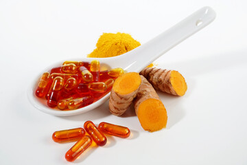 Cucurmin Pills with Turmeric Powder and Root isolated on white Background - Healthy Nutrition