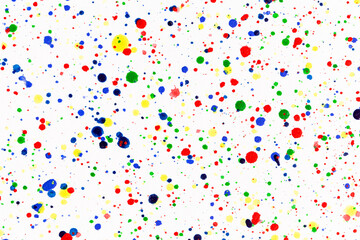 Paint splatters on bright material. Watercolor on white paper.