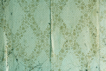 Old wallpaper on the wall.Old wallpaper for texture or background.