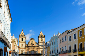 Fototapeta na wymiar Facades of old and historic church and houses in colonial and baroque style in the tourist center of Pelourinho, city of Salvador, Bahia