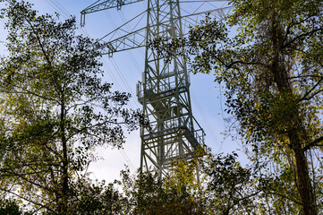 A power pylon or transmission line with mounted cellular antennas for GSM and 5G