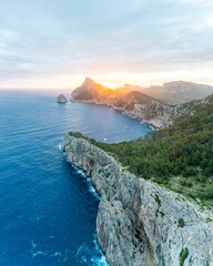 Vertical aerial shot of sunrise at the Mirador es Colomer on the beautiful island of Mallorca, Spain