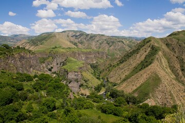Fototapeta na wymiar Aerial view of beautiful rocky cliffs and mountains in the rural countryside of Armenia