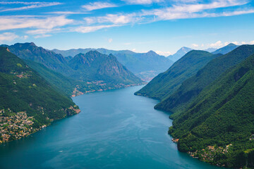 Spectacular panoramic view over the city of Lugano, the Lugano Lake and Swiss Alps, visible from Monte San Salvatore observation terrace, canton of Ticino, Switzerland.