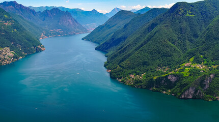 Spectacular panoramic view over the city of Lugano, the Lugano Lake and Swiss Alps, visible from Monte San Salvatore observation terrace, canton of Ticino, Switzerland.