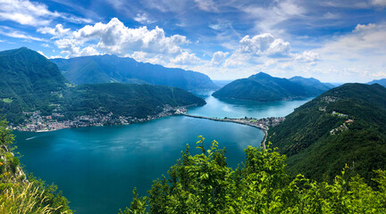 Fototapeta na wymiar Spectacular panoramic view over the city of Lugano, the Lugano Lake and Swiss Alps, visible from Monte San Salvatore observation terrace, canton of Ticino, Switzerland.