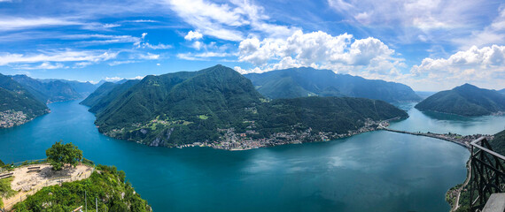 Spectacular panoramic view over the city of Lugano, the Lugano Lake and Swiss Alps, visible from Monte San Salvatore observation terrace, canton of Ticino, Switzerland.