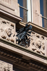 detailed dragon of the facade of a building © Marten