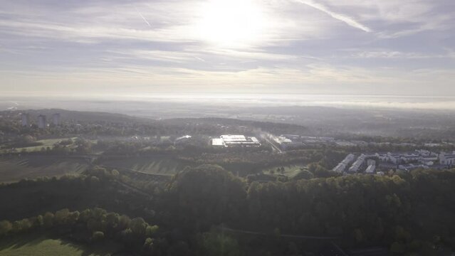 Aerial time lapse shot of a residential area in district B&ouml;fingen of Ulm city. In the background is the landscape of Swabia on a cloudy morning in autumn