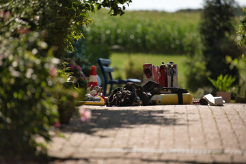 Equipment from a fire brigade attack team for a fire-fighting attack lies ready on the ground