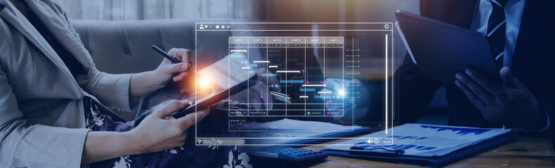 Analyst working with computer in Business Analytics and Data Management System to make report with KPI and metrics connected to database. Corporate strategy for finance, operations, sales, marketing