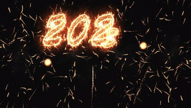 Burning inscription 2023 neon appearing one fiery number on a black background fireworks for the new year. Overall plan