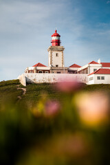 Fototapeta na wymiar The colorful ligthouse of Cabo Da Roca, on the most western point of Europe