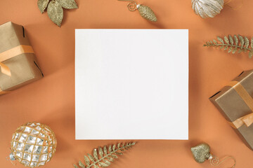 Festive composition with empty greeting card and Christmas decorations. Top view, mockup, flat lay