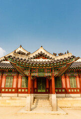 Naklejka premium Colorful exterior of a pavilion in the park of Changdeokgung palace in Seoul, South Korea, Asia