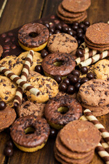 Beautiful chocolate, doughnuts, chocolate stick, and chocolate chip cookies background