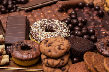 Beautiful chocolate, doughnuts, chocolate stick, and chocolate chip cookies background