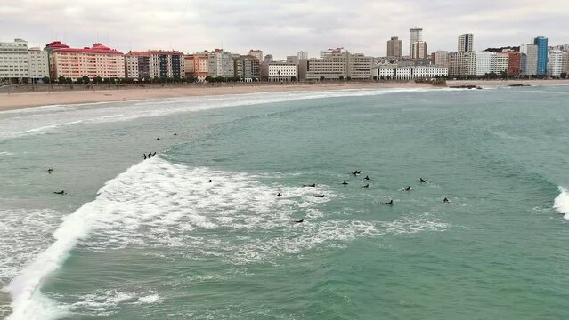 Surf school students practicing from Orz&aacute;n Beach in La Coru&ntilde;a