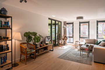 Beautiful and large living room interior with hardwood floors and white ceiling in new home