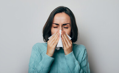 Young woman with a high temperature is coughing. Sick female with flu and headache. Rhinitis, cold,...