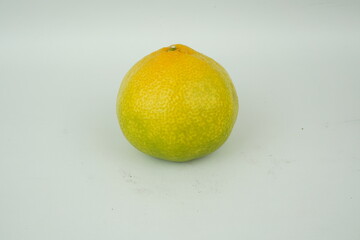 orange tangerines in front of a white background