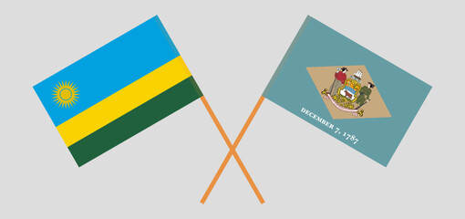 Crossed flags of Rwanda and The State of Delaware. Official colors. Correct proportion