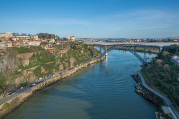 Fototapeta na wymiar Douro River with Maria Pia Bridge and Sao Joao Bridge - Porto, Portugal
