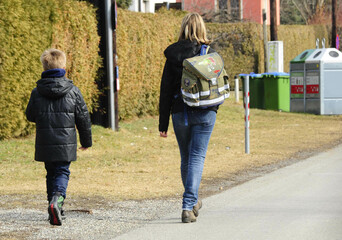 mother and child on their way to school