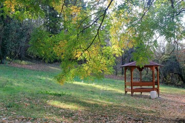 Wooden gazebo in the autumn park of Madara (Bulgaria)

