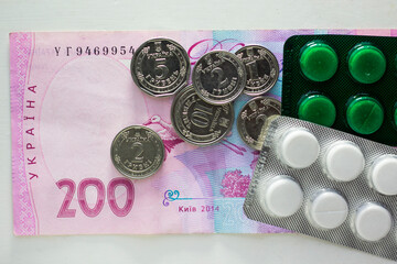 Ukrainian currency with pills and kopecks close-up - obrazy, fototapety, plakaty