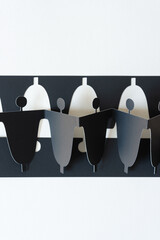 abstract figurative paper shapes on black paper stencil