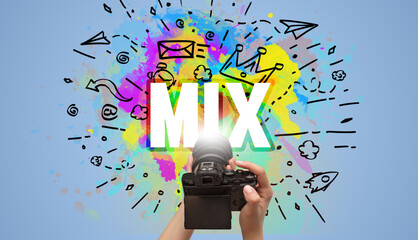 Close-up of a hand holding digital camera with abstract drawing