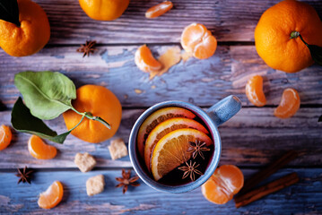 Mulled wine with oranges and anise in a blue cup
