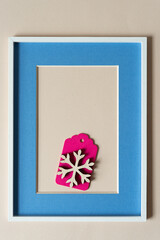 snowflake ornament frame with blue mat and wood border