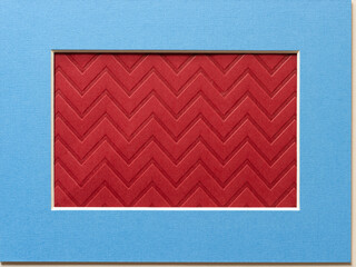 grungy red brown paper with chevron pattern framed in blue mat with beveled edge