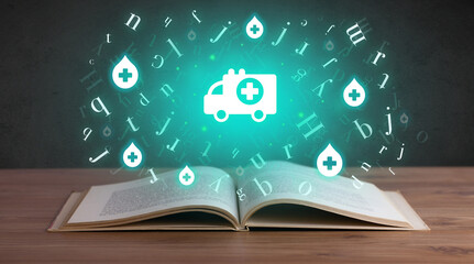 Open medical book with health icons above