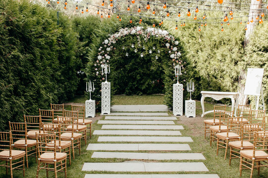 Italian wedding decoration. Green eucalyptus, oranges and pink flowers decorate wedding altar. cauntry Moldova